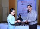 Participant receiving the certificate from Shri Rakesh Garg, Secretary, Textiles Committee